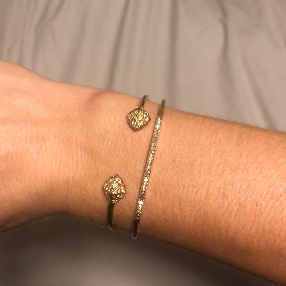 TWO gold Stella and dot bangles